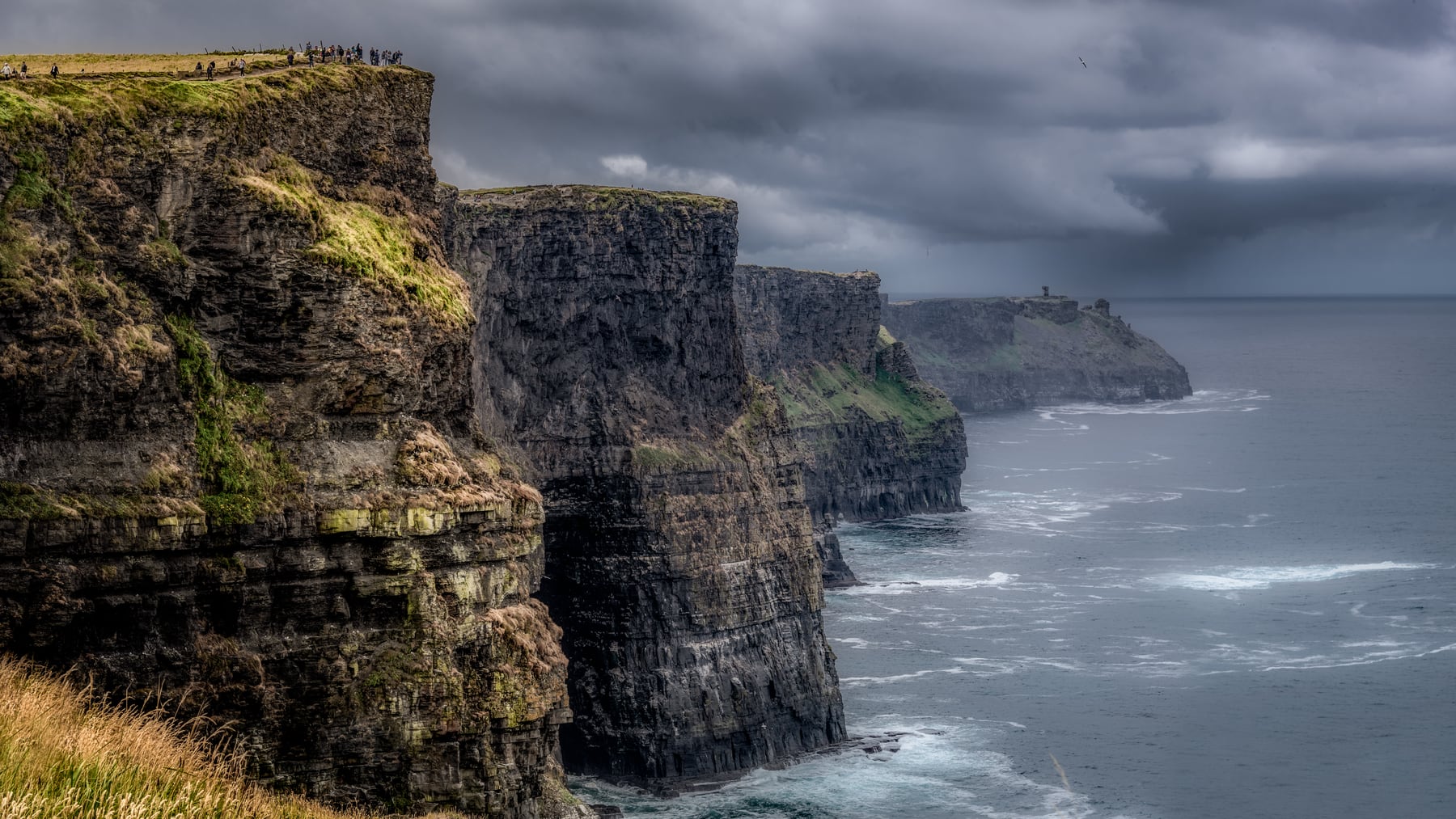 The Cliffs of Moher receding into the Atlantic